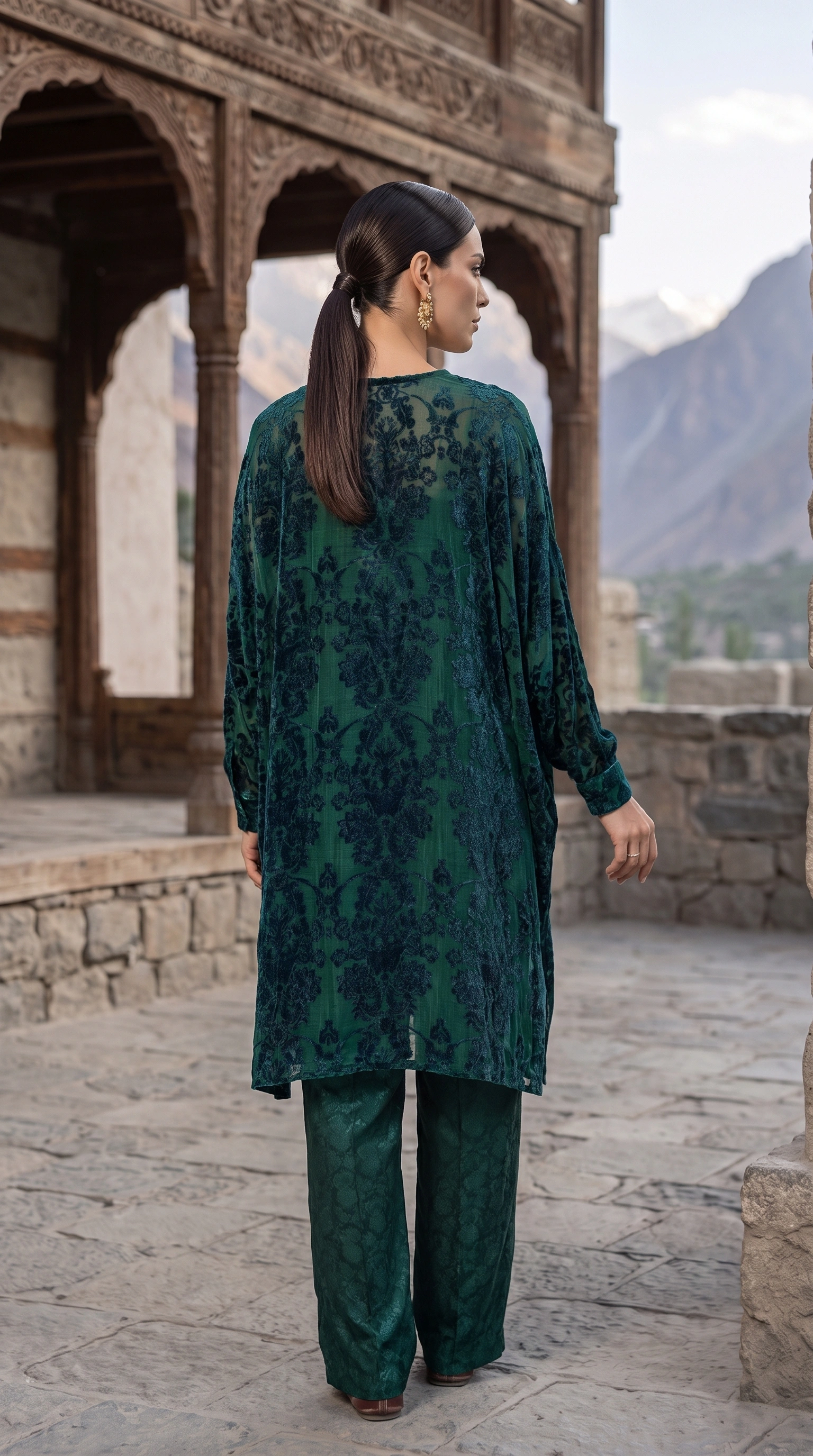 Back view of Malachite Cascade showing the patterned devoré velvet and relaxed silhouette
