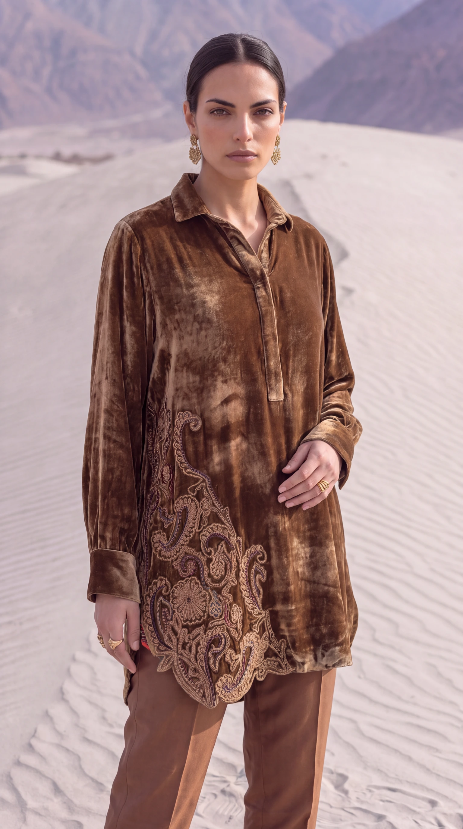 Close detail of the tonal appliqué and corded paisley embroidery