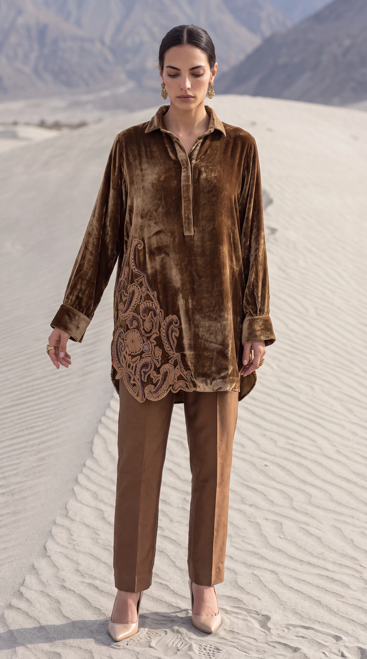Front editorial view of Umber Paisley showing its sweeping embroidered side panel